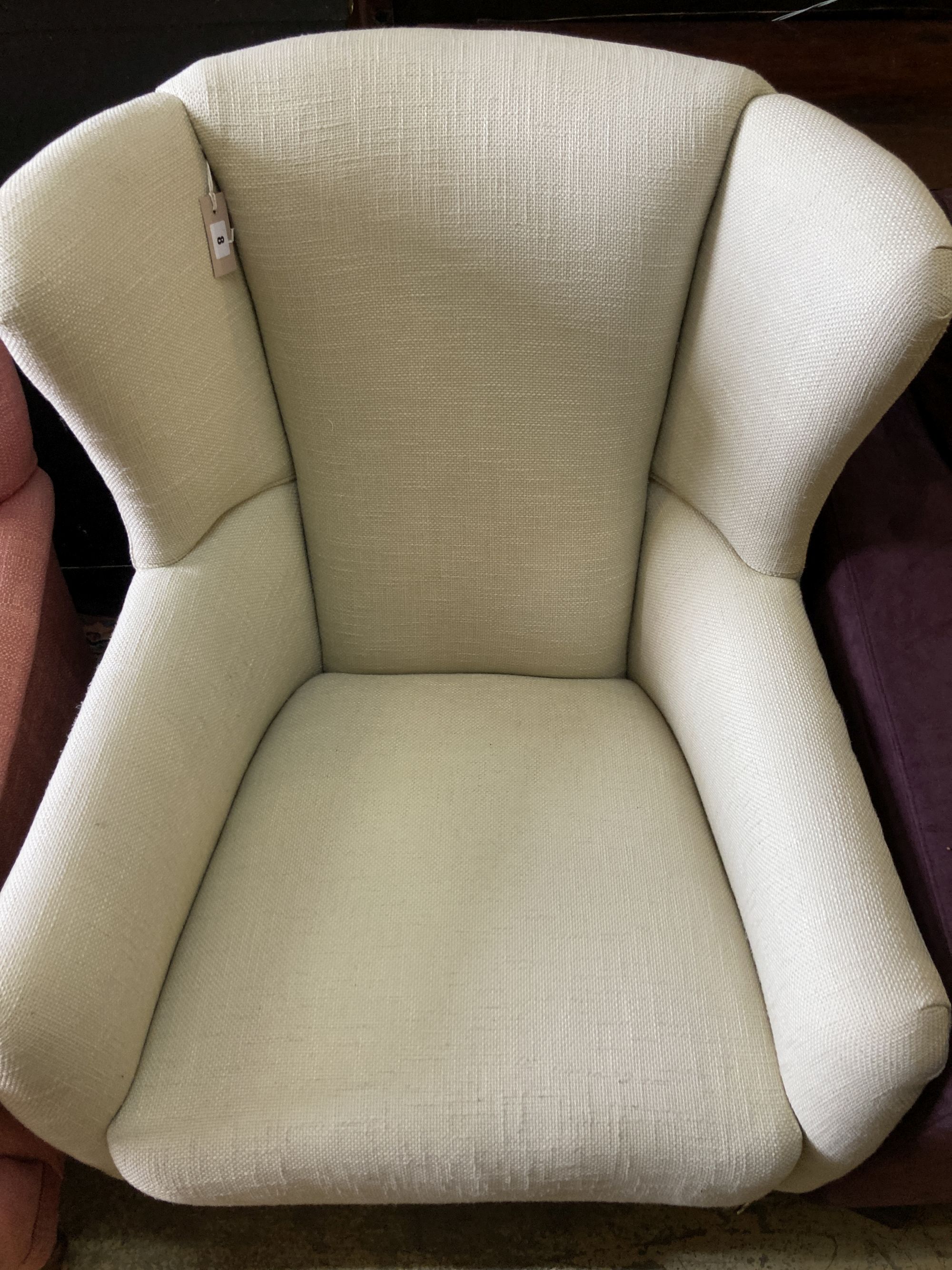 A contemporary upholstered armchair, width 68cm, depth 80cm, height 96cm